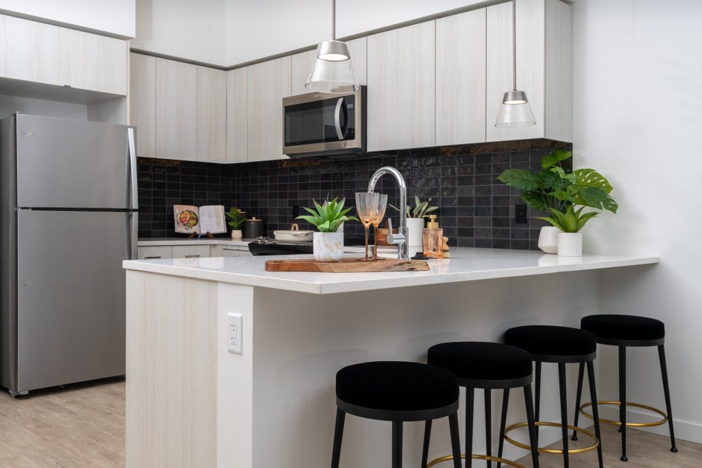Copal Bellevue Apartments kitchen with breakfast bar